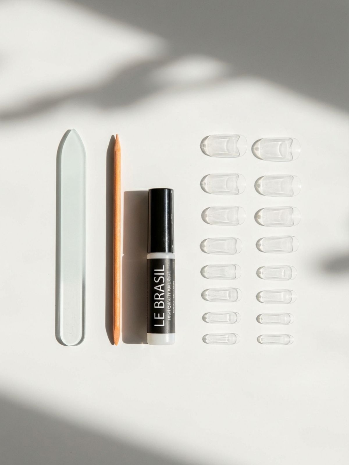 Press-On Nails Maintenance Routine - Gathering the right tools, including high-quality resin and glass files, is the first step to longevity.