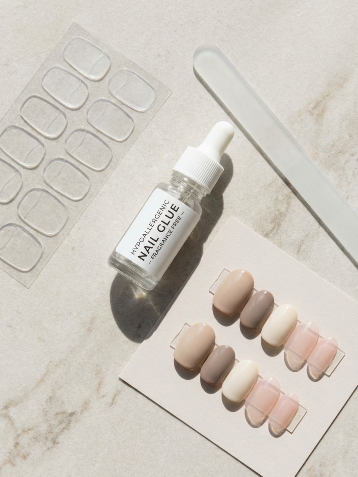 Press-On Nails for Sensitive Nails - Choosing the right tools, like adhesive tabs and glass files, minimizes trauma to sensitive nails.