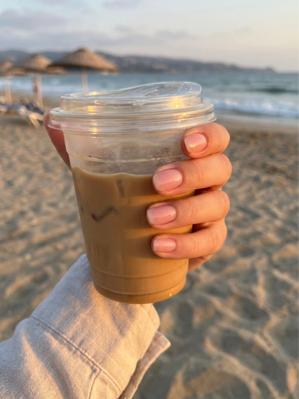 Minimal Nails for Beach Vacation - Sheer pink glossy nails capture the clean girl aesthetic perfectly for a seaside getaway.